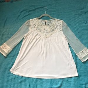 Blouse with lace and button on back.